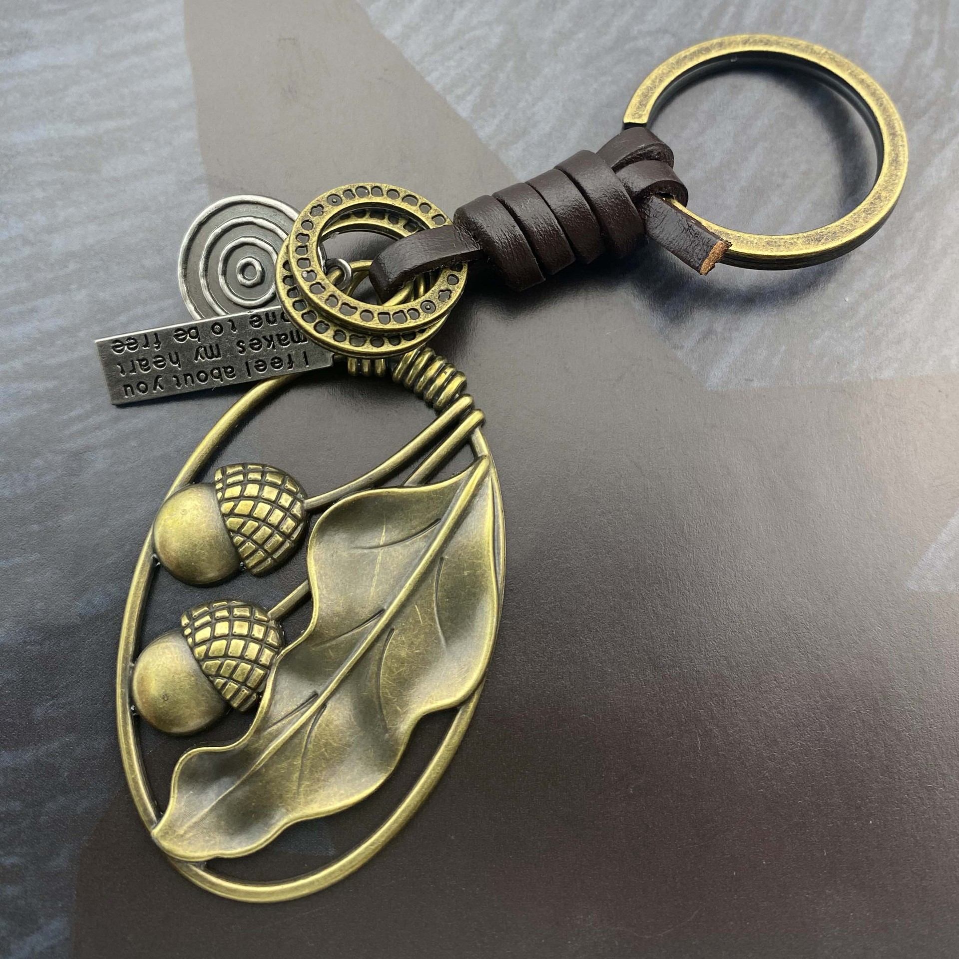 Picture of Cross-border New Hand-woven Retro Kraft Fruit Cotyledon Keychain Tourist Area Gift Gift Bag Hanging Ornaments
