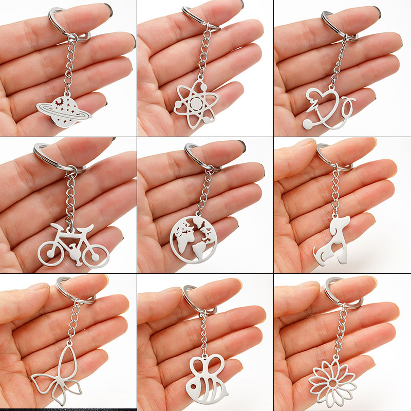 Picture of Japanese and Korean stainless steel metal keychain ins devil love bicycle stethoscope pendant schoolbag pendant in stock