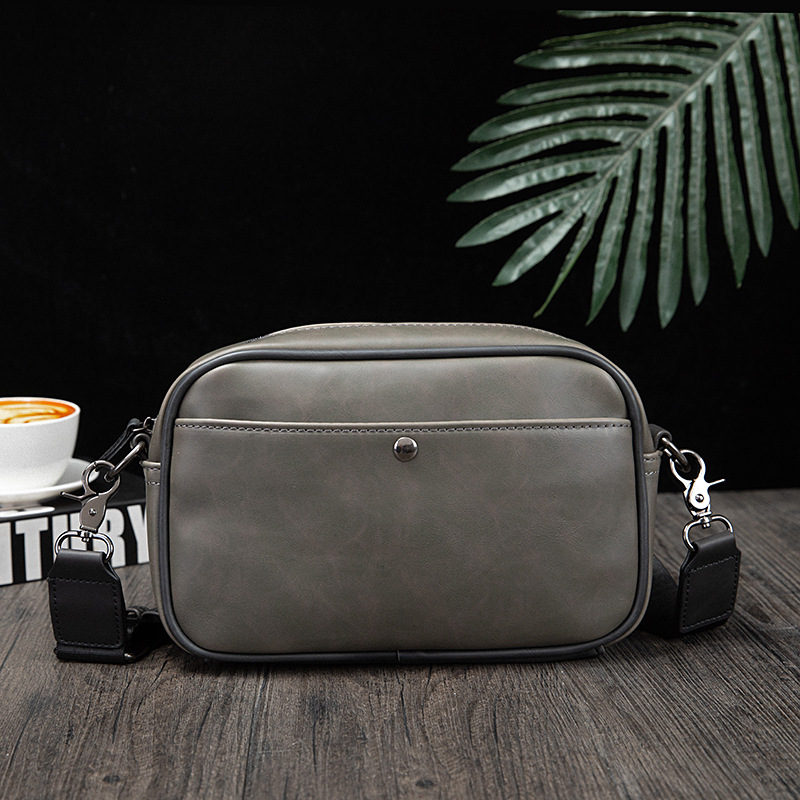 Picture of Korean fashion Men's messenger bag 2024 New retro solid color small backpack casual shoulder phone bag for men