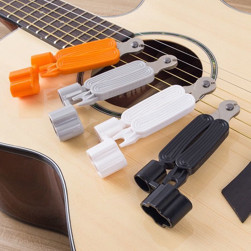 Picture of Guitar accessories guitar three-in-one string reel multi-function three-in-one string cutter string cutter pliers string reel Nail lifting