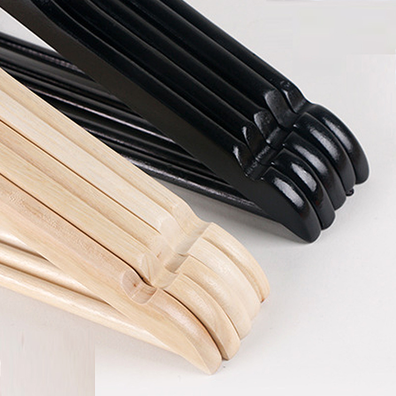 Picture of First-class flat head solid wood hanger black and white men's clothes drying rack home wardrobe clothes rack black wooden hanger wholesale