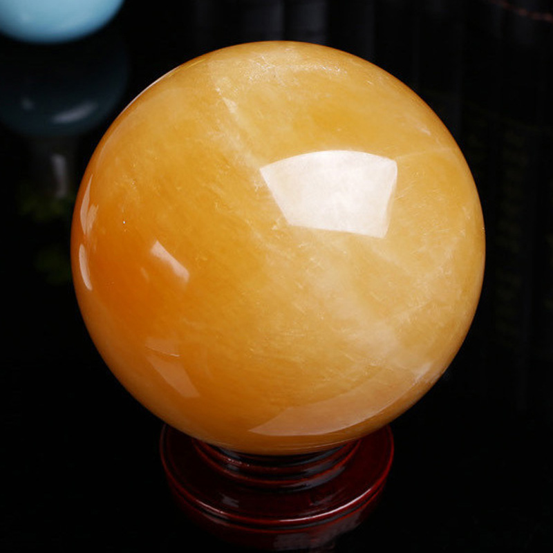 Picture of Natural yellow crystal ball ornaments yellow crystal ball original stone size a generation of direct selling gifts