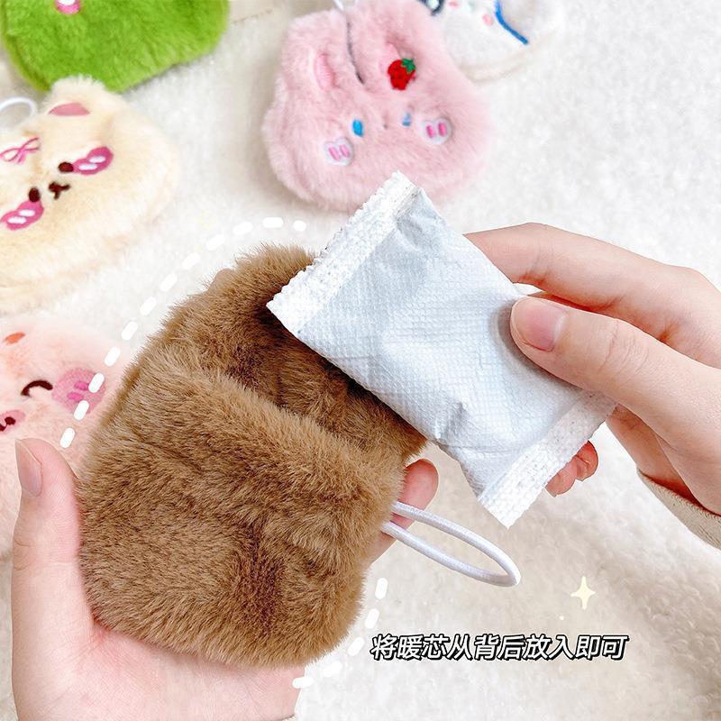 Picture of Cartoon plush hand warmer warm self-heating student compact portable warm egg warm baby hand warmer wholesale