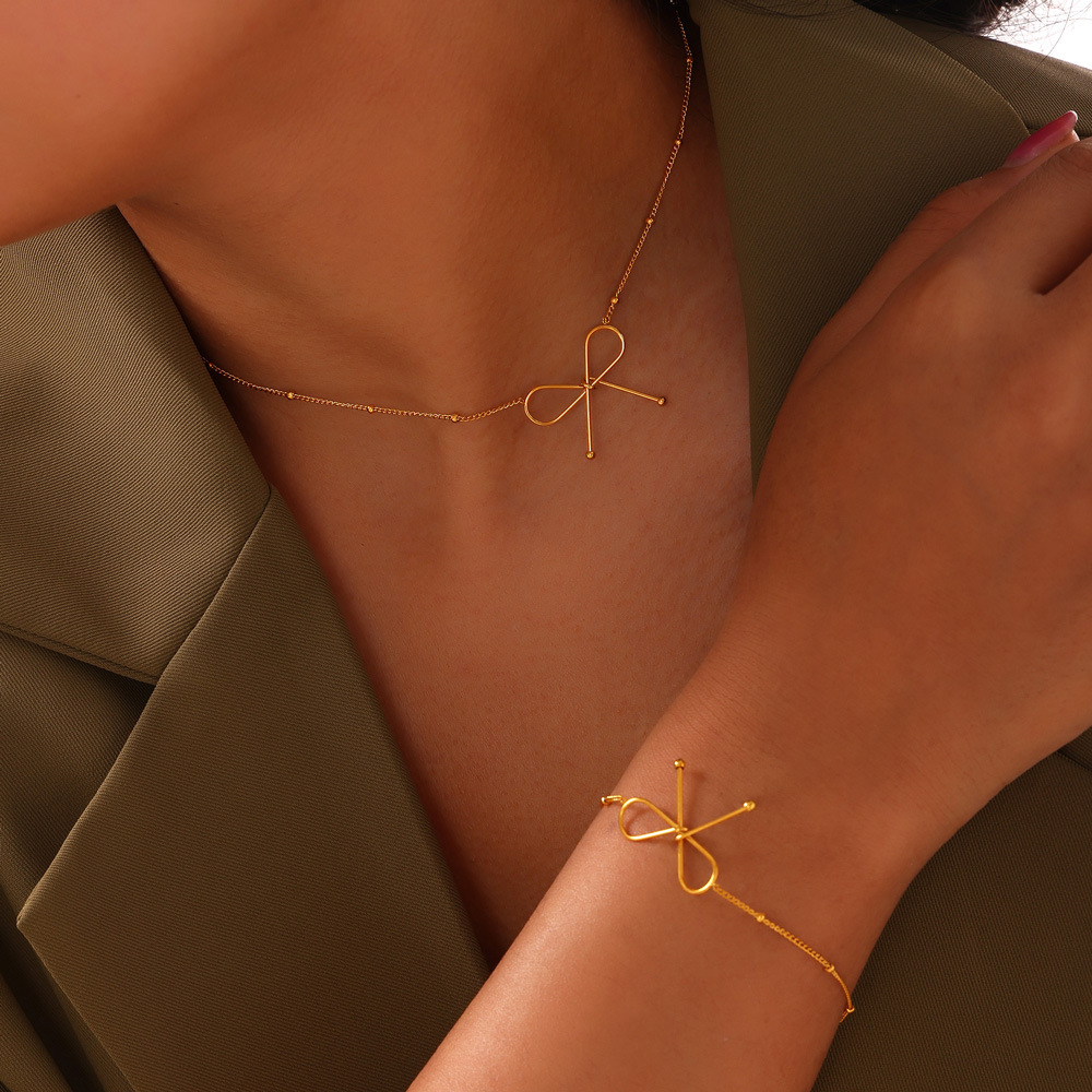 Italian magazine simple style clavicle chain titanium steel plated 18K real gold bracelet jewelry set bow necklace