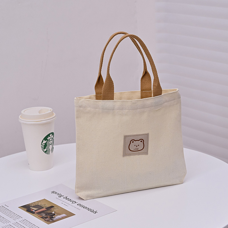 Picture of 2025 New Cute Cartoon Japanese Style Canvas Bag Tutorial Lunch Bag Manufacturer Wholesale Bag Women's Bag Handbag