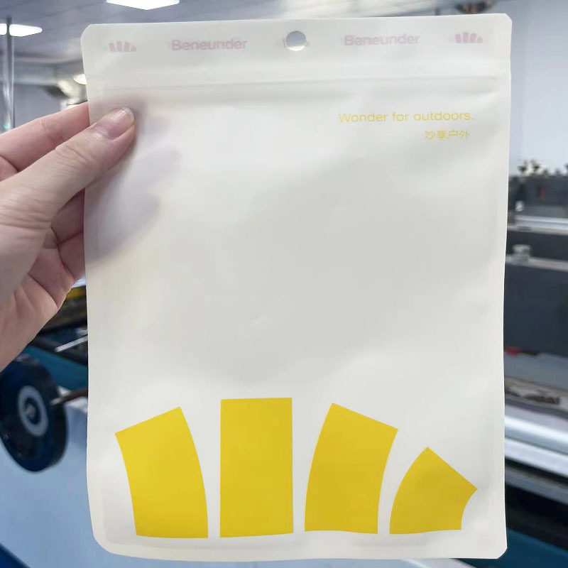 Milk yellow matte PE disposable mask self-sealing bag three-sided sealing hanging hole translucent bone plastic packaging bag