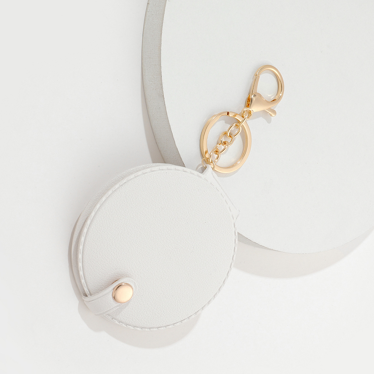 Picture of Creative round makeup mirror keychain pu leather car bag pendant carry-on solid color mini small mirror