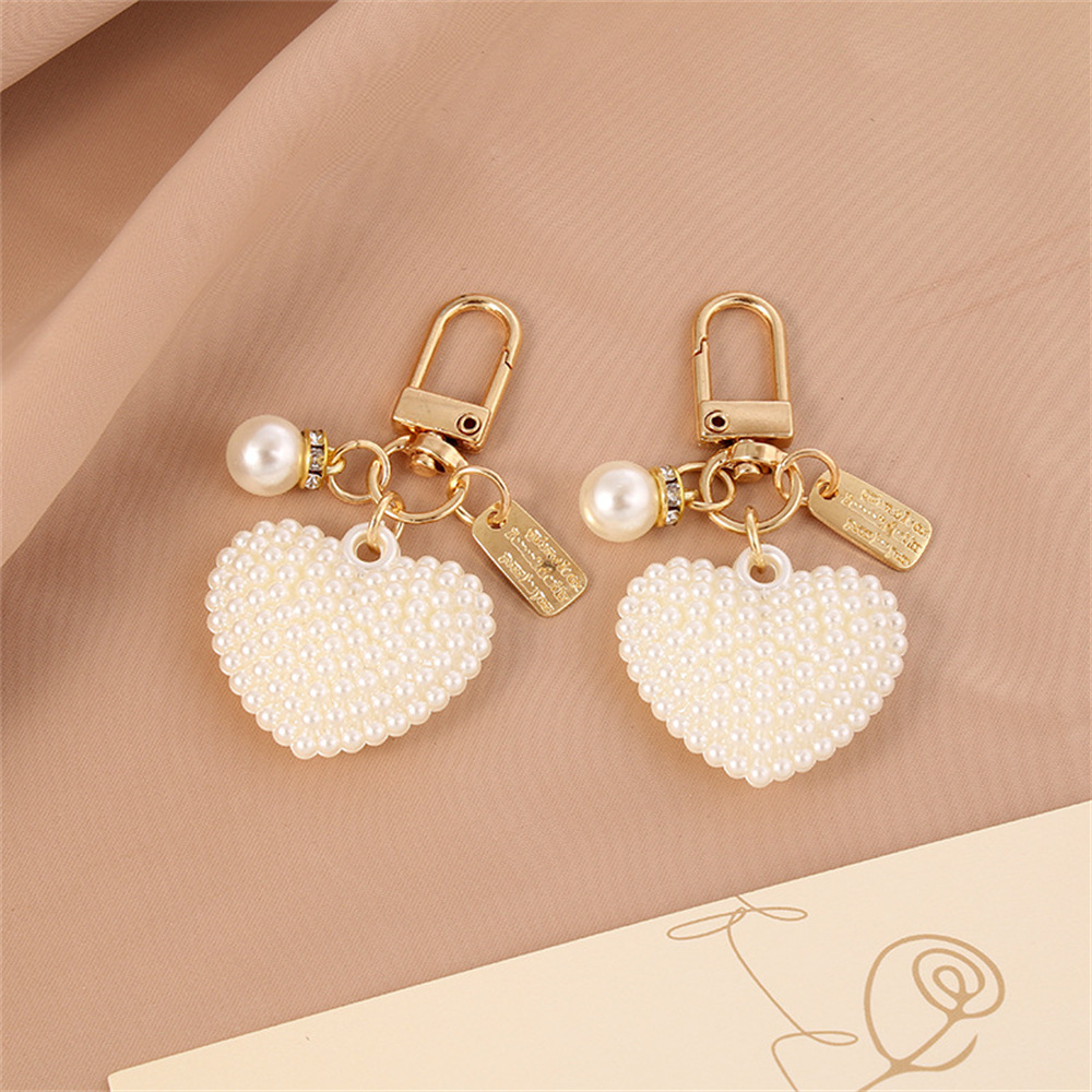 Picture of New Pearl Alloy Keychain Pendant Creative Pearl Hollow Love Accessories Bluetooth Headphone Box Bag Pendant