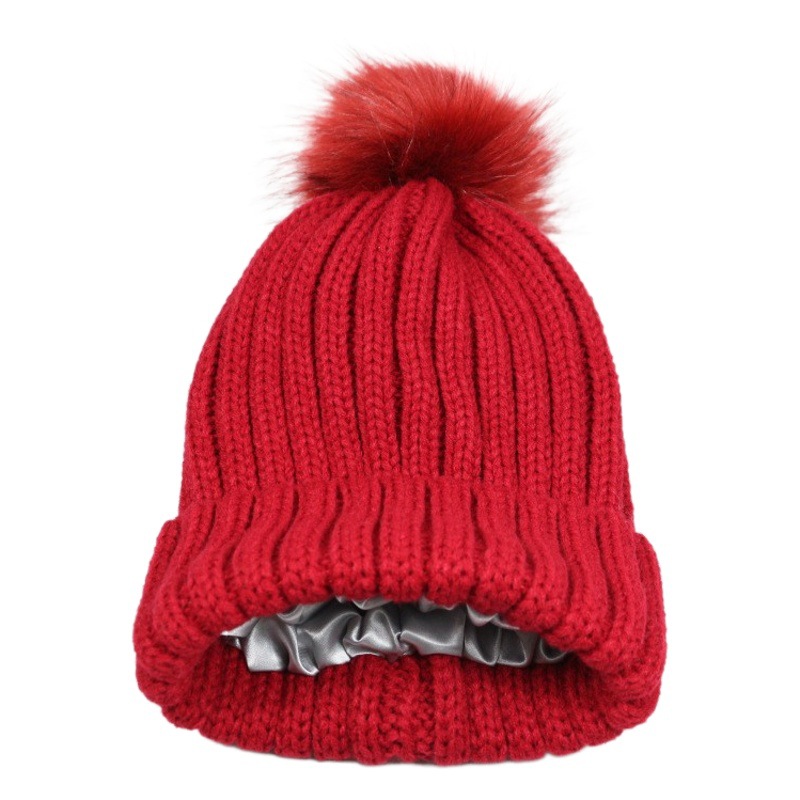 Autumn and Winter knitted satin lining wool hat urine hat European and American style satin knitted hat fur ball detachable