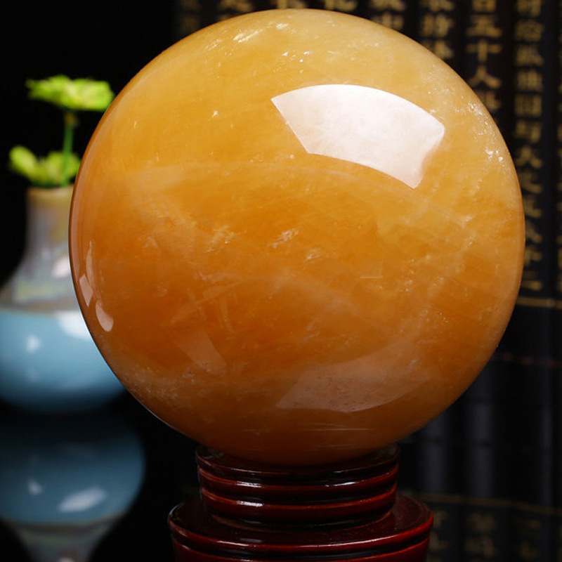 Picture of Natural yellow crystal ball ornaments yellow crystal ball original stone size a generation of direct selling gifts
