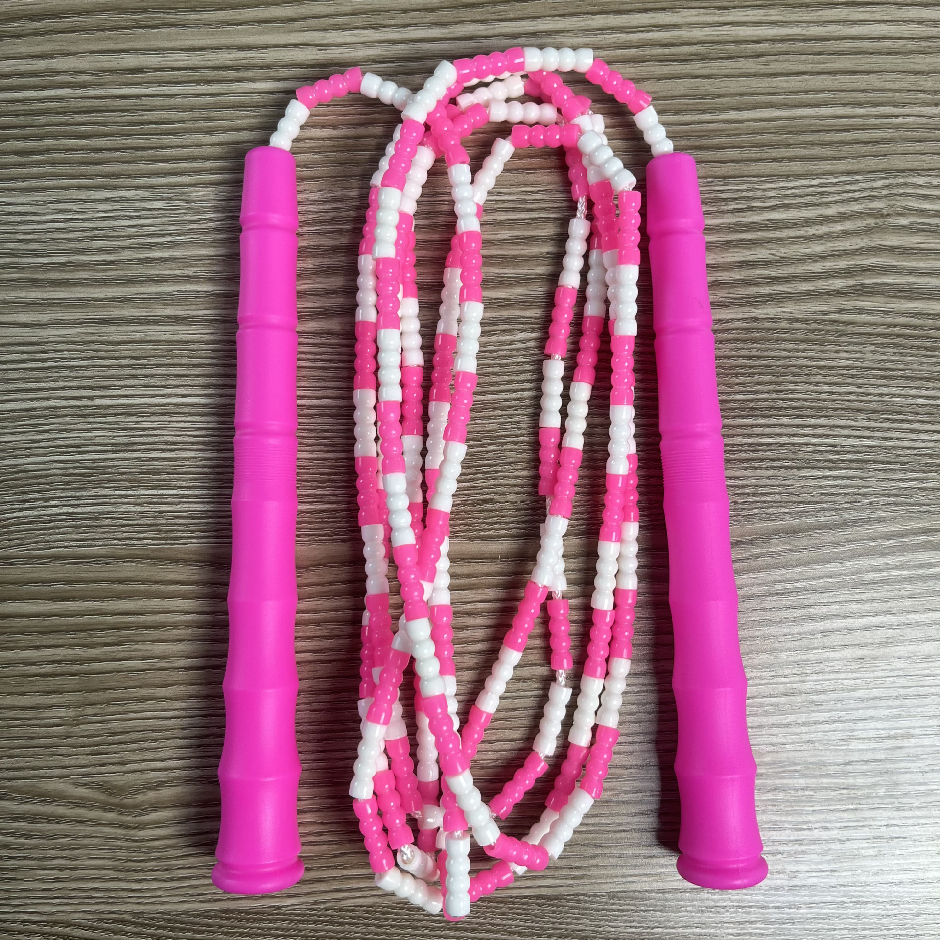 Picture of Manufacturer Wholesale Children's Fitness Sports Pattern Skipping Rope Kindergarten Competition Soft Bead Bamboo Skipping Rope for Primary School Students