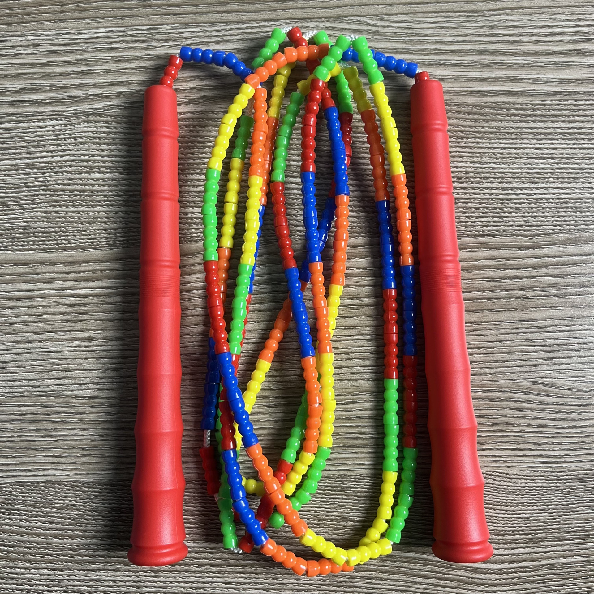 Picture of Manufacturer Wholesale Children's Fitness Sports Pattern Skipping Rope Kindergarten Competition Soft Bead Bamboo Skipping Rope for Primary School Students