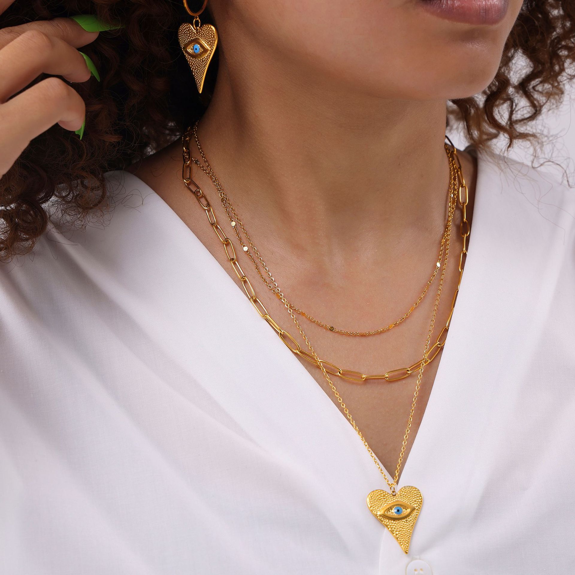 Hot sale European and American style fashionable suit heart-shaped devil's eye pendant earrings multi-layer necklace titanium steel plated 18k gold