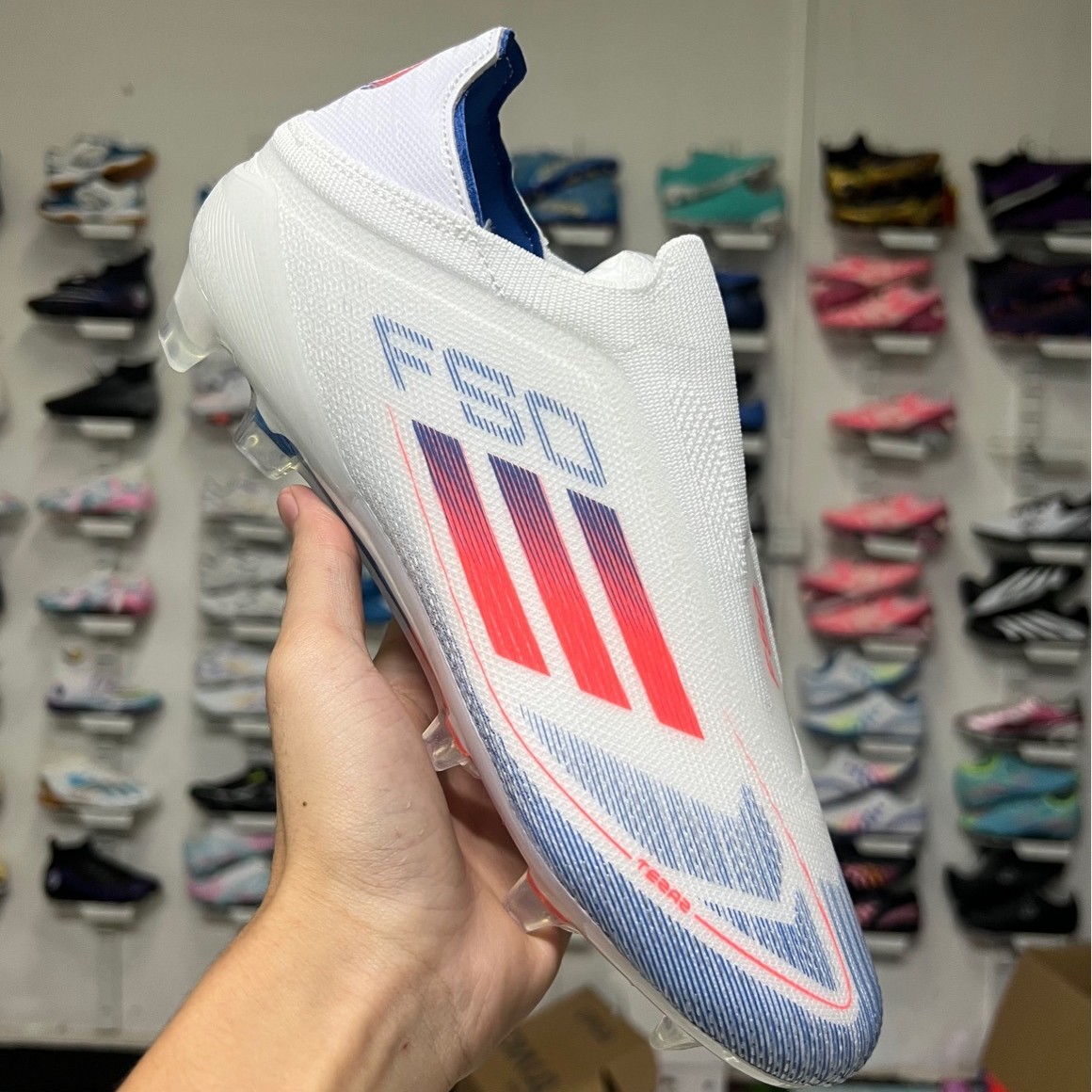 Foreign trade cross-border wholesale X series fg nail spikes without shoelaces men's sneaker game new style football shoes