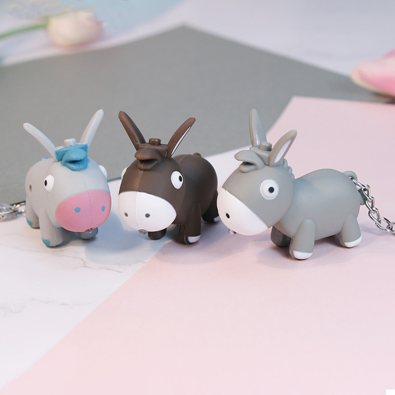 LED sound luminous cartoon donkey silly keychain children's schoolbag pendant luggage accessories toy manufacturers set