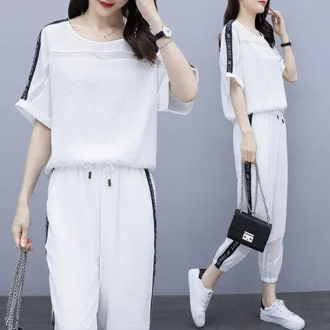 Design Sense suit Summer Fashion Elegant Trend Stitching Loose Short-sleeved Leg Trousers Two-piece plus size Women's Clothing