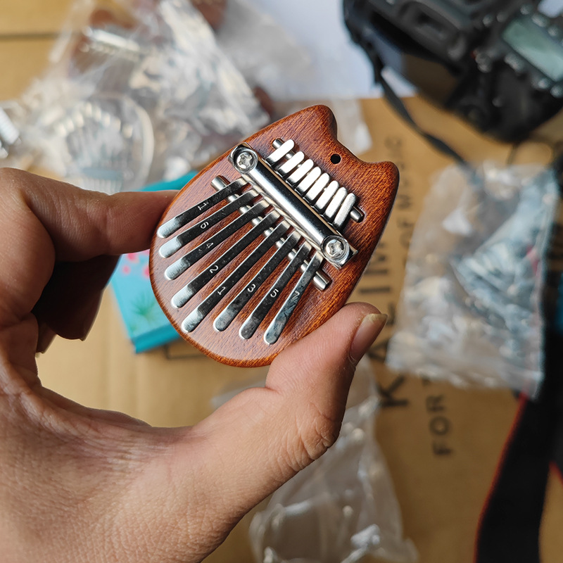 Picture of Mini Thumb 8-Tone Mini Calimba Crystal Transparent Five-Finger Portable Beginner's Finger Instrument