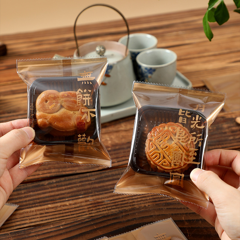 New moon cake packaging bag 50g 75g thickened mid-autumn Festival bottom support flow heart self-sealing egg yolk crisp machine sealing bag wholesale