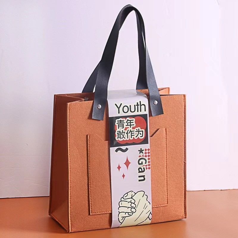 Picture of Little Red Book Portable Felt Bag 2025 Year of the Snake New Year Gift Box New Creative Accompanying Gift Annual Meeting Anniversary of Enterprises