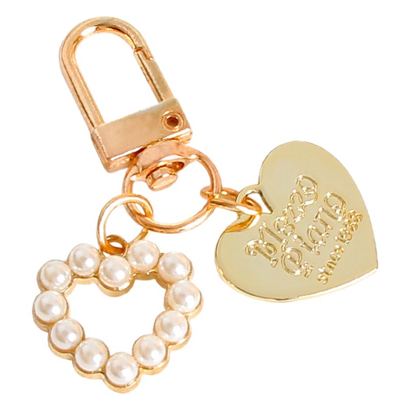 New peach heart Shell Pearl alloy key chain bag personalized metal jewelry conch female decorative pendant