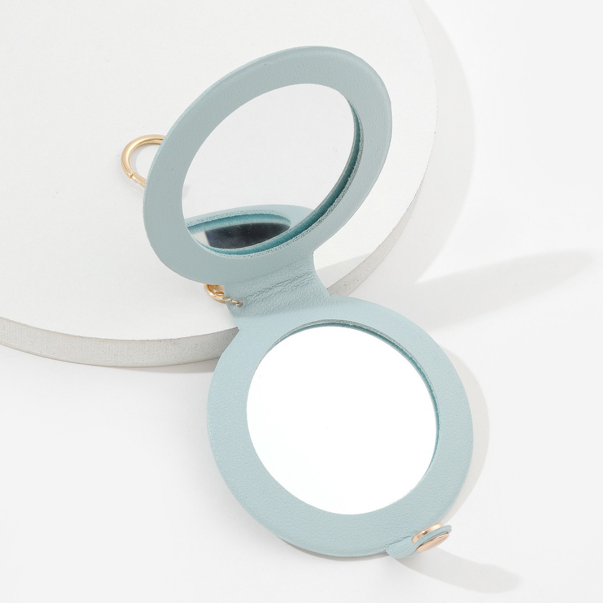 Picture of Creative round makeup mirror keychain pu leather car bag pendant carry-on solid color mini small mirror