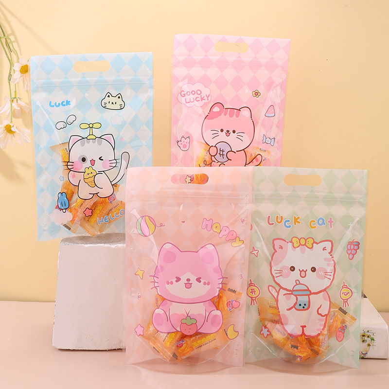 Color print cartoon KT cat 12 silk plastic dried fruit self-sealing self-supporting packaging bag biscuit sealed moisture-proof zipper bag wholesale