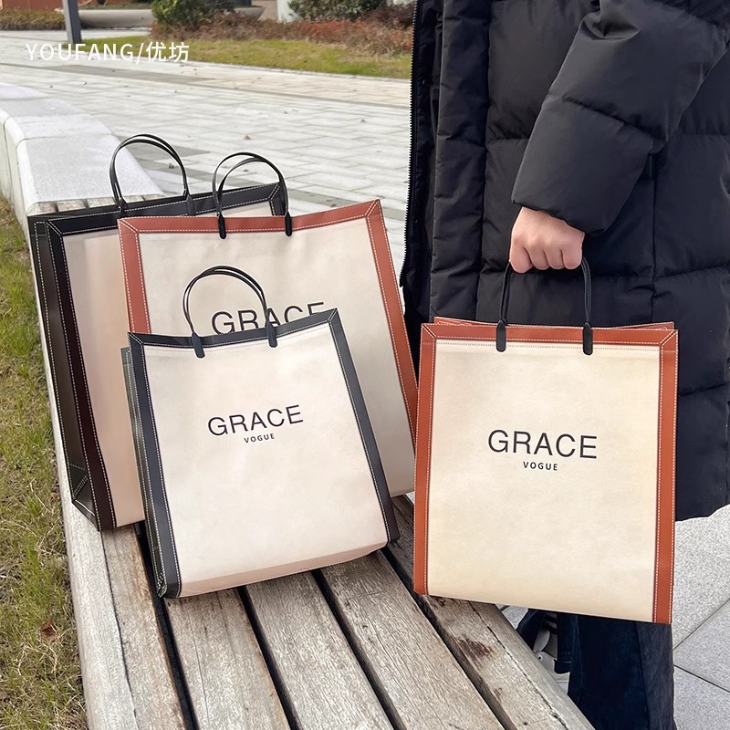 Vertical version non-woven fabric coated clothing store handbag large clothes bag out of fashion shopping bag system