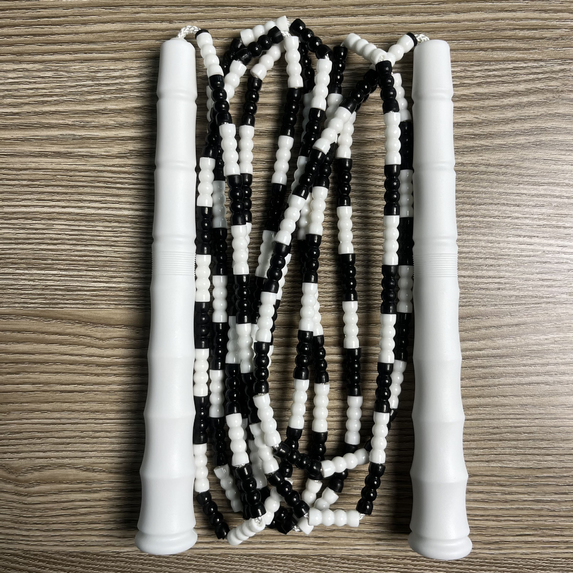 Picture of Manufacturer Wholesale Children's Fitness Sports Pattern Skipping Rope Kindergarten Competition Soft Bead Bamboo Skipping Rope for Primary School Students