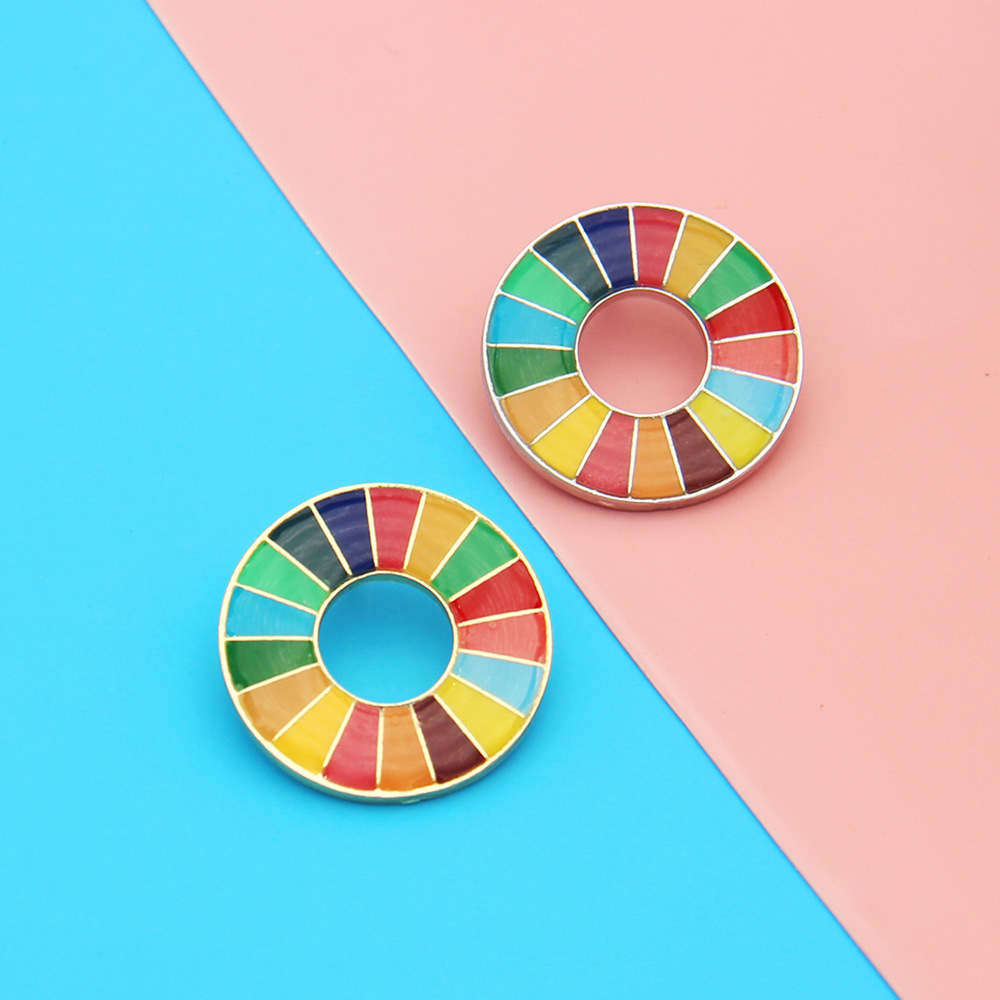 Picture of United Nations peace pigeon brooch sustainable development goal medal representative geometric pattern 17 color oil dripping necklace