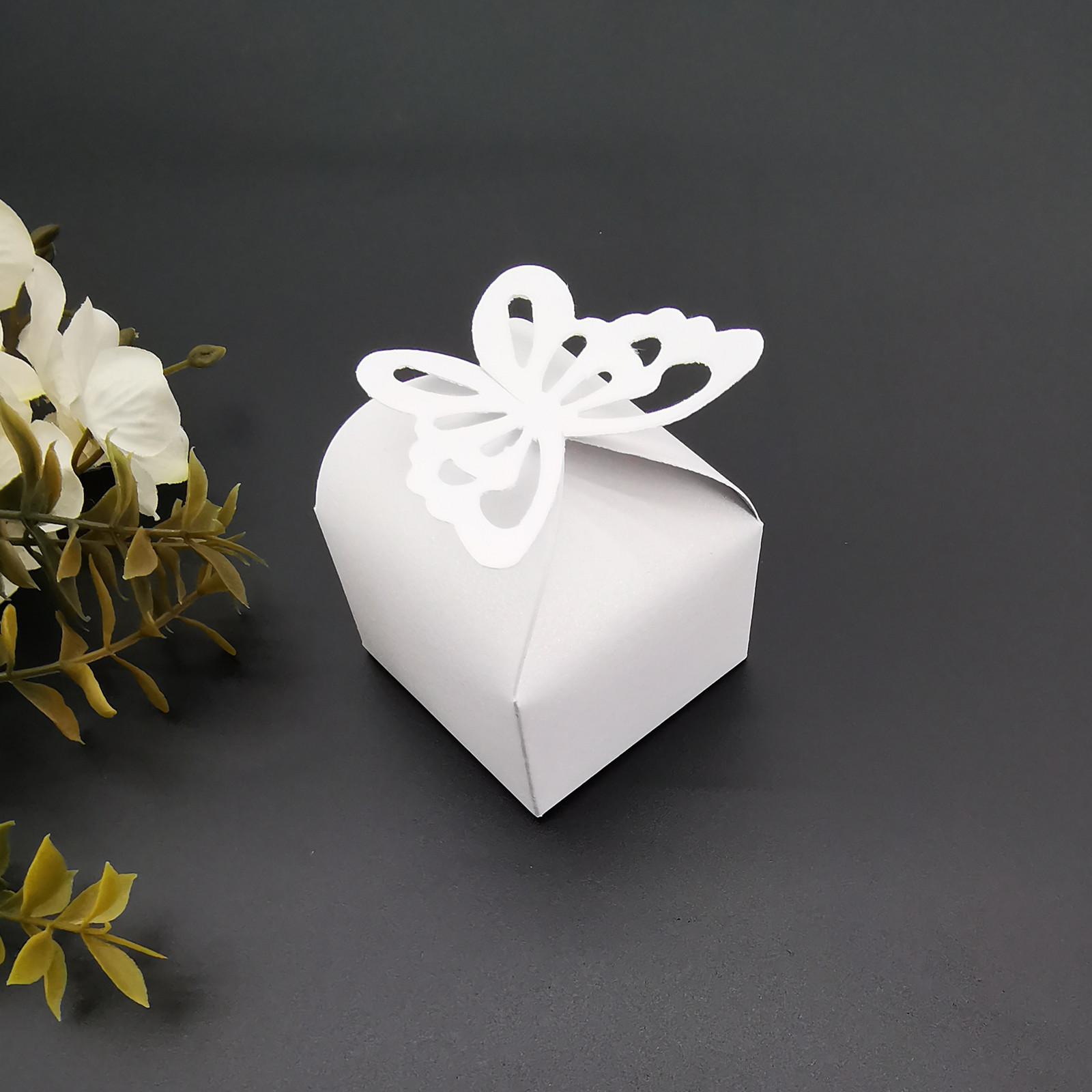 Picture of Wedding candy box hollow butterfly candy paper box square simple pearl paper gift box golden pink paper box