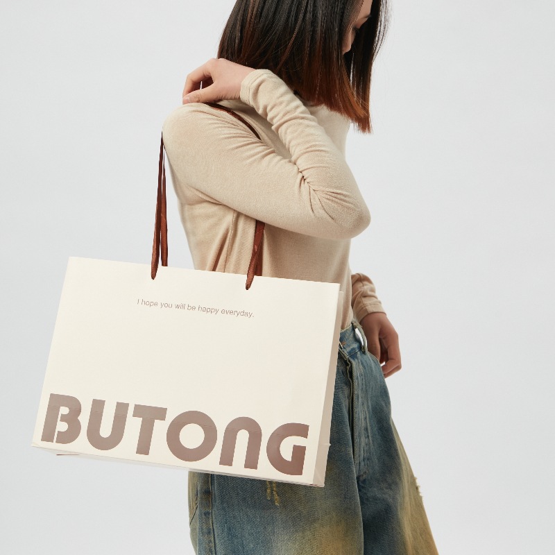 Handbag paper bag custom gift bag packaging clothing store clothes custom printed logo thick fixed high-end