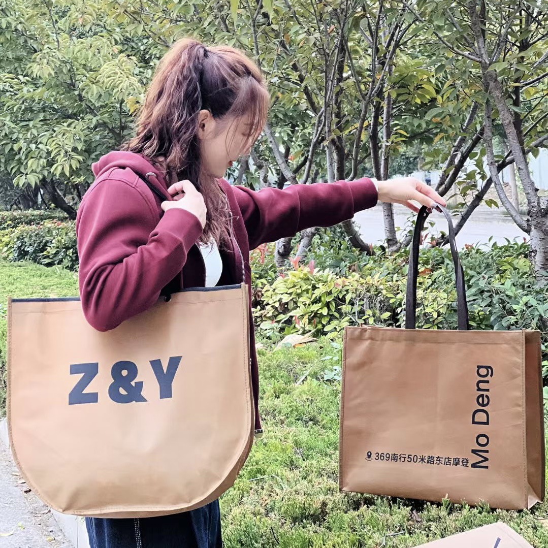 Non-woven tote bag custom environmental protection large sewing clothing shopping drawstring concealed buckle packaging bag in stock high sense