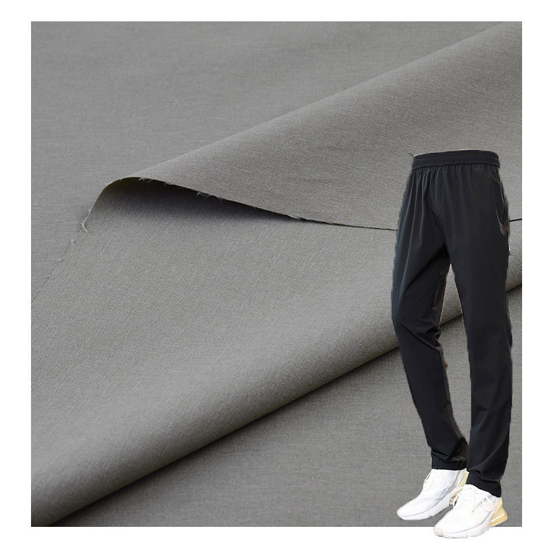 70D+40D 70% Jin 18% polyester 12% spandex 120G Jin polyester four-way stretch plain weave sports pants fabric