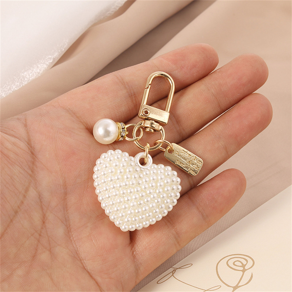 Picture of New Pearl Alloy Keychain Pendant Creative Pearl Hollow Love Accessories Bluetooth Headphone Box Bag Pendant