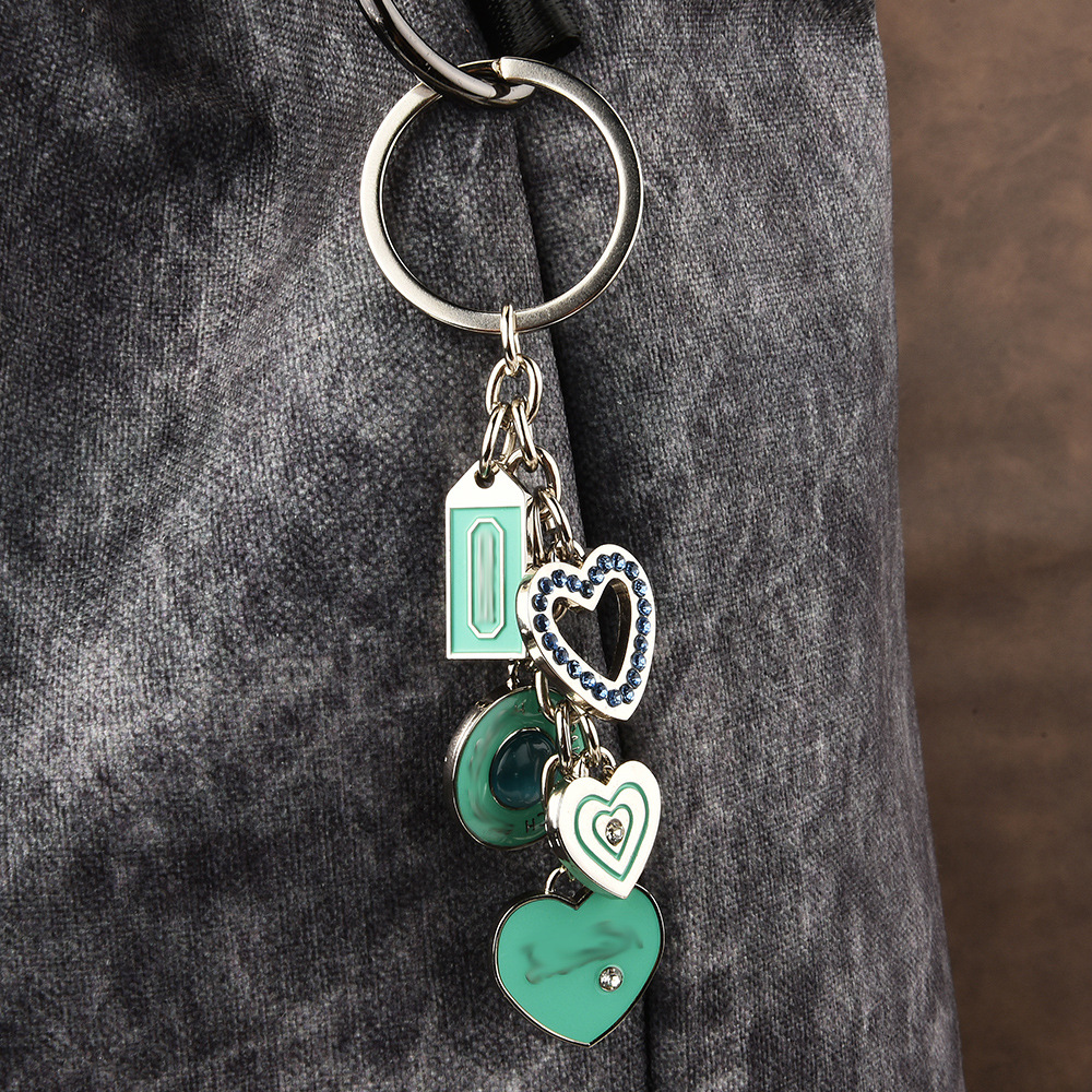 Manufacturers sell exquisite cat's eye stone love key chain pendant couple metal car key chain cross-border wholesale jewelry