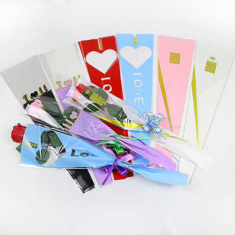 Qixi Valentine's Day flower packaging material heart window triangle single heart translucent single rose packaging bag