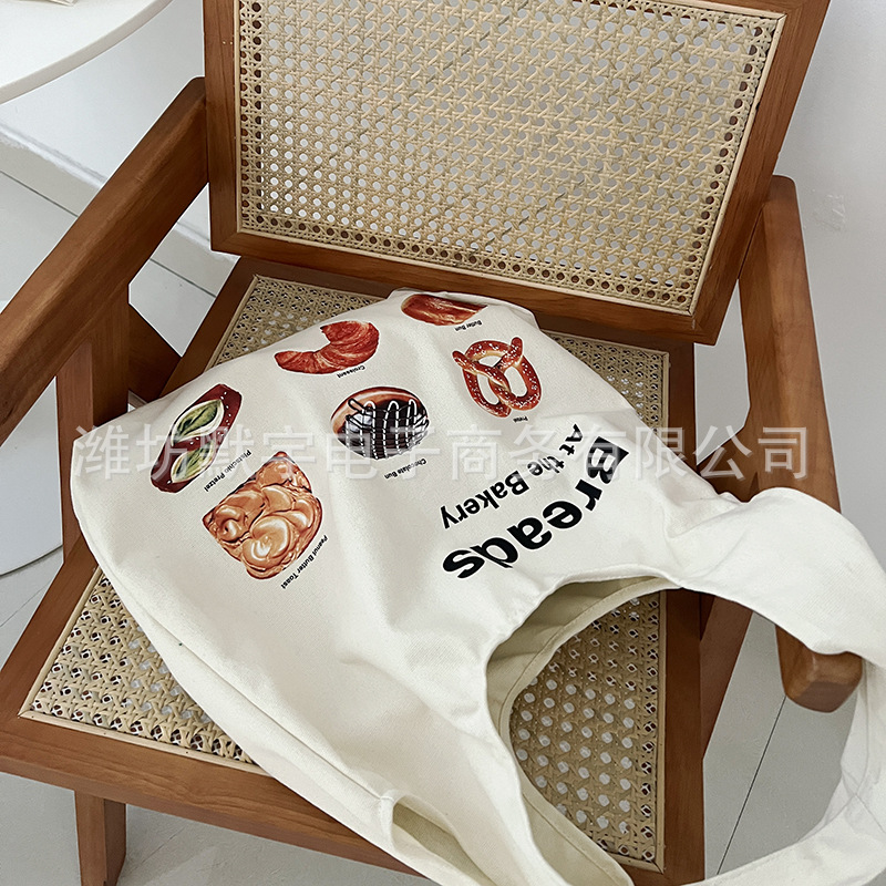 Picture of Bufan Liangpin/[plagiarism stop] bread illustration canvas bag women's shoulder horn bag large capacity shopping bag