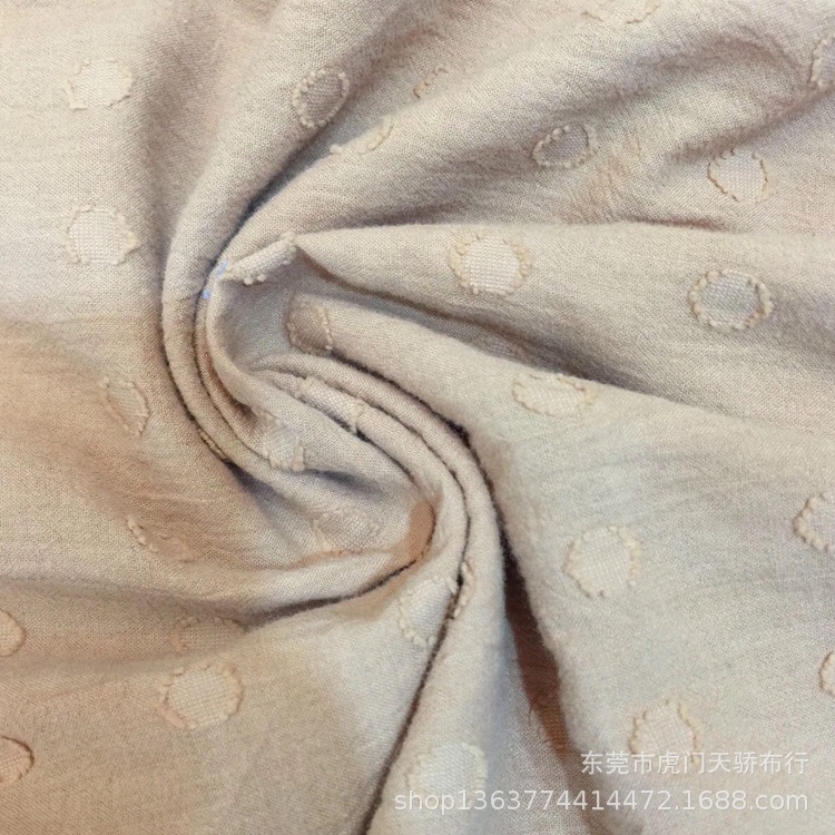Spring and summer new woven cotton dot jacquard 75g thin sand wash sand cloth Jacquard dot cut flower clothing material
