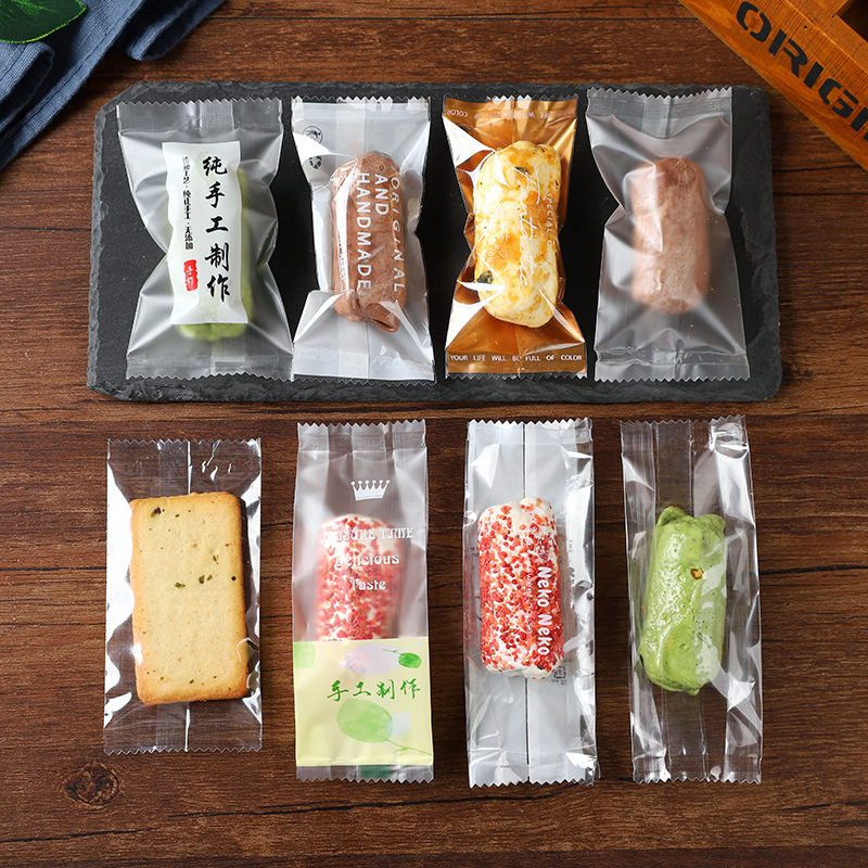 Net red souffle packaging machine bag-sealed milk cake fish-shaped glutinous rice boat transparent cookie almond snowflake baked self-sealing
