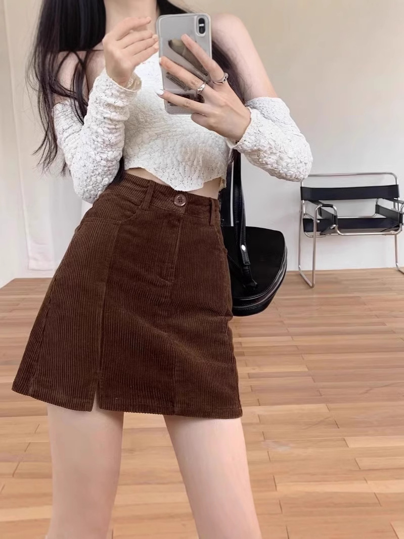 One-step skirt versatile black short Korean version 2025 corduroy fashion high-waisted tight skirt women's autumn hip skirt