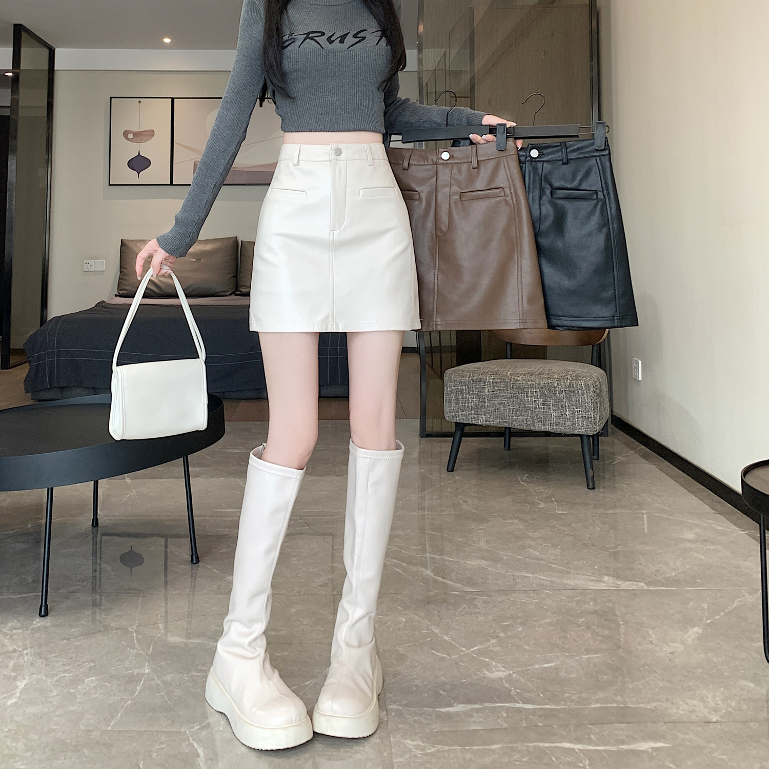 Black pu leather skirt women's 2025 new autumn and winter short skirt anti-light high waist A- line hip skirt