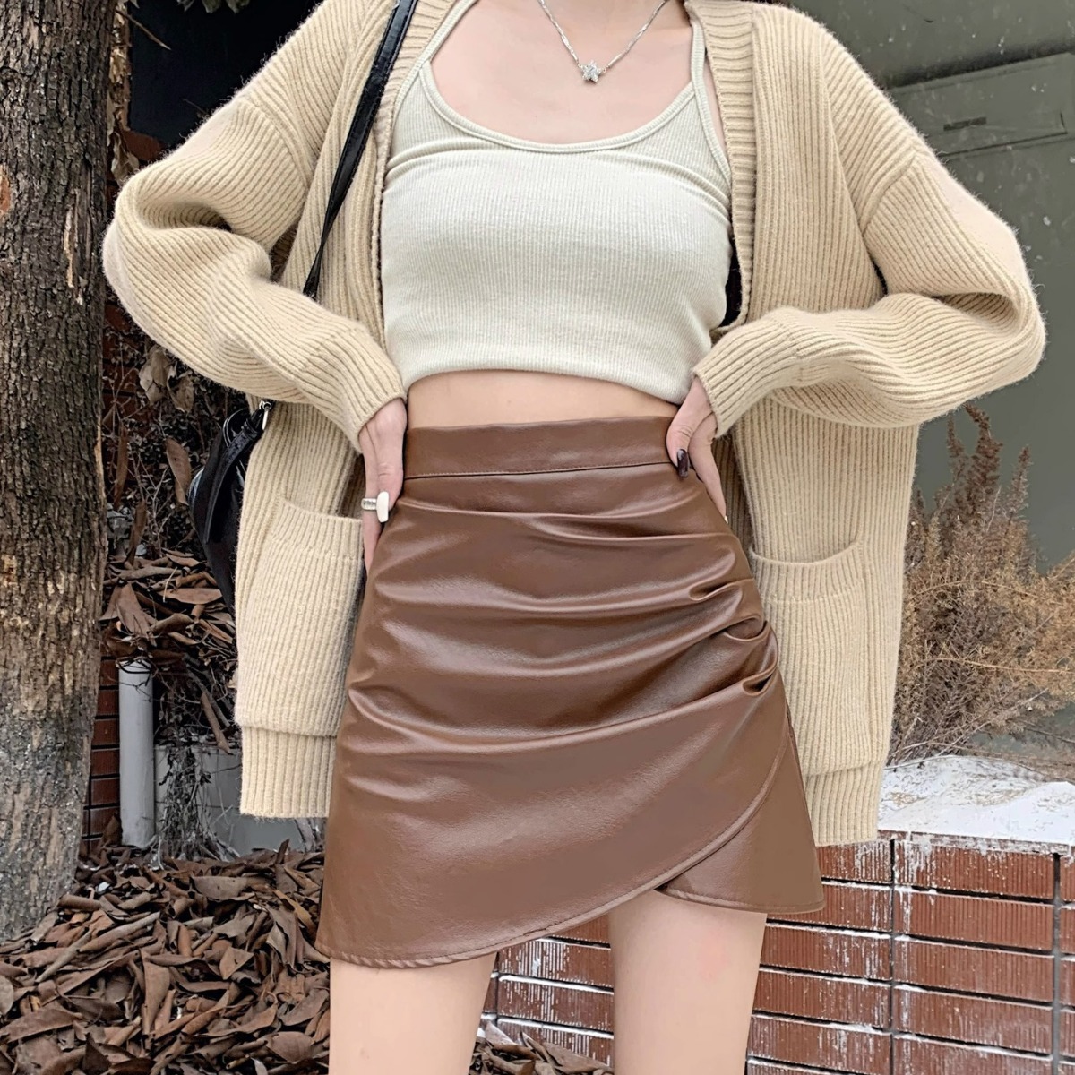 Hot girl irregular pleated PU leather skirt women's autumn and winter 2023 new high waist slimming a-Line hip skirt