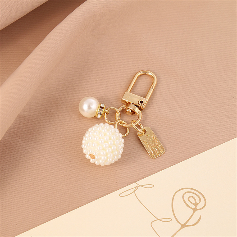 Picture of New Pearl Alloy Keychain Pendant Creative Pearl Hollow Love Accessories Bluetooth Headphone Box Bag Pendant
