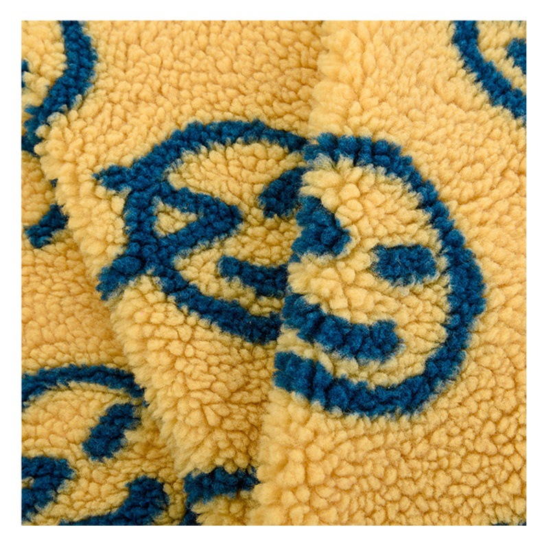Cartoon smiley face jacquard lambswool 350g polyester single-sided lambswool children's clothing luggage coat lambswool fabric