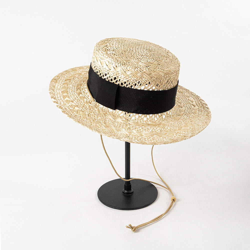 European and American spring and summer fashion hand woven hollow wide webbing strap sisal flat straw hat outdoor shopping sunshade hat