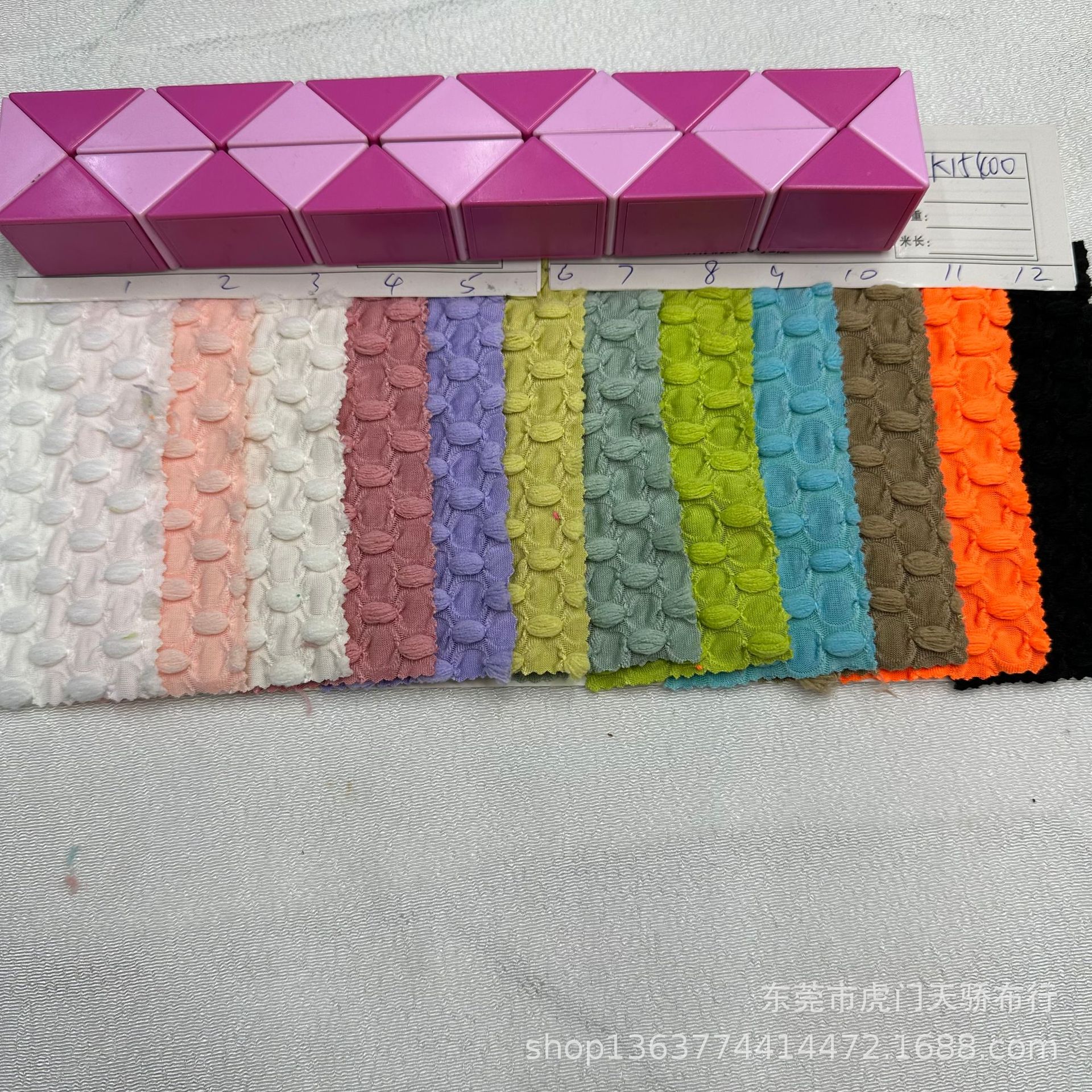 Spot supply of new knitted wool ball jacquard cloth knitted Oval dot jacquard cloth swimwear yoga clothing material