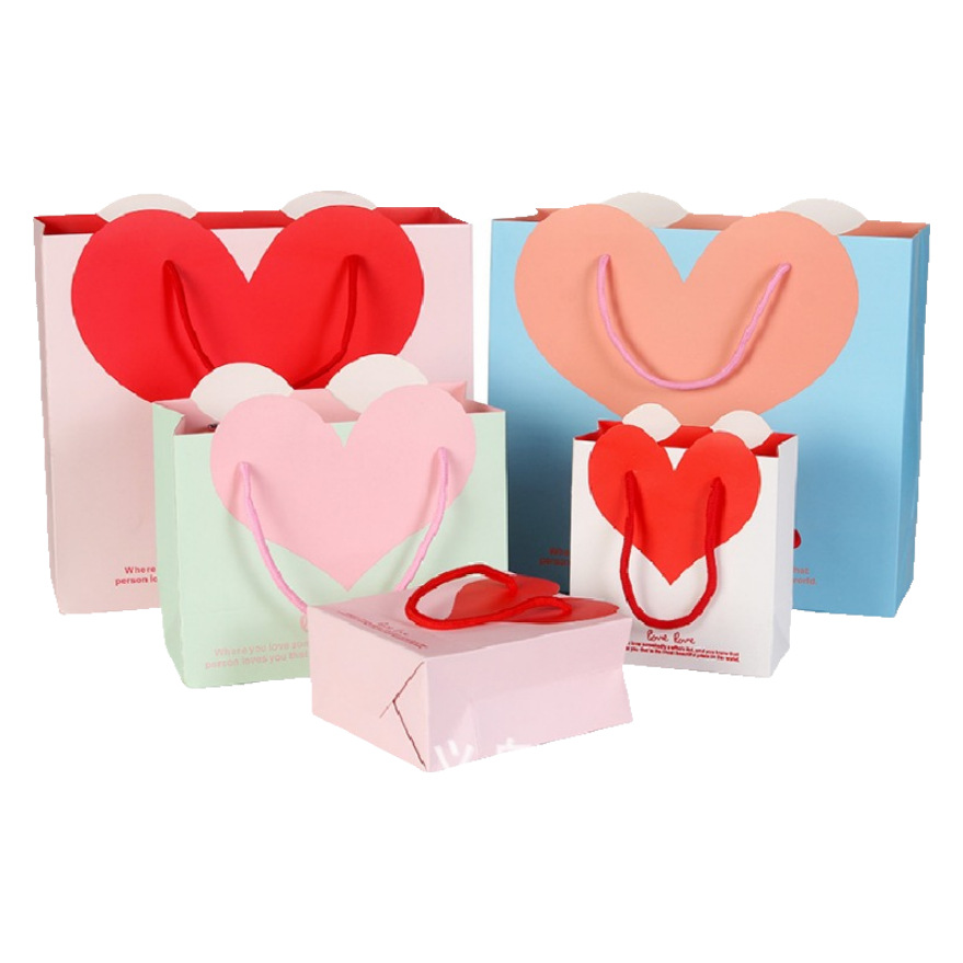 Factory spot wholesale love gift bag wedding gift bag portable packaging paper bag heart-shaped printed logo