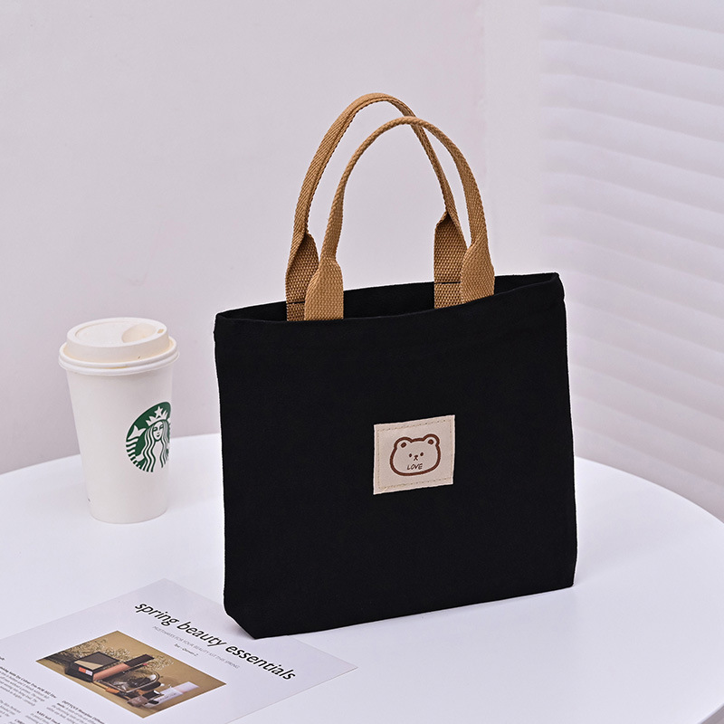Picture of 2025 New Cute Cartoon Japanese Style Canvas Bag Tutorial Lunch Bag Manufacturer Wholesale Bag Women's Bag Handbag