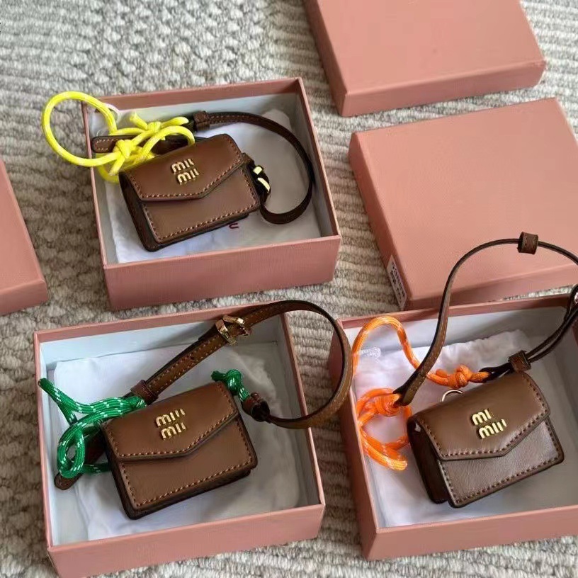 2024 new brown artificial cowhide rope ornaments small square bag earphone bag mini coin purse pendant bag manufacturers