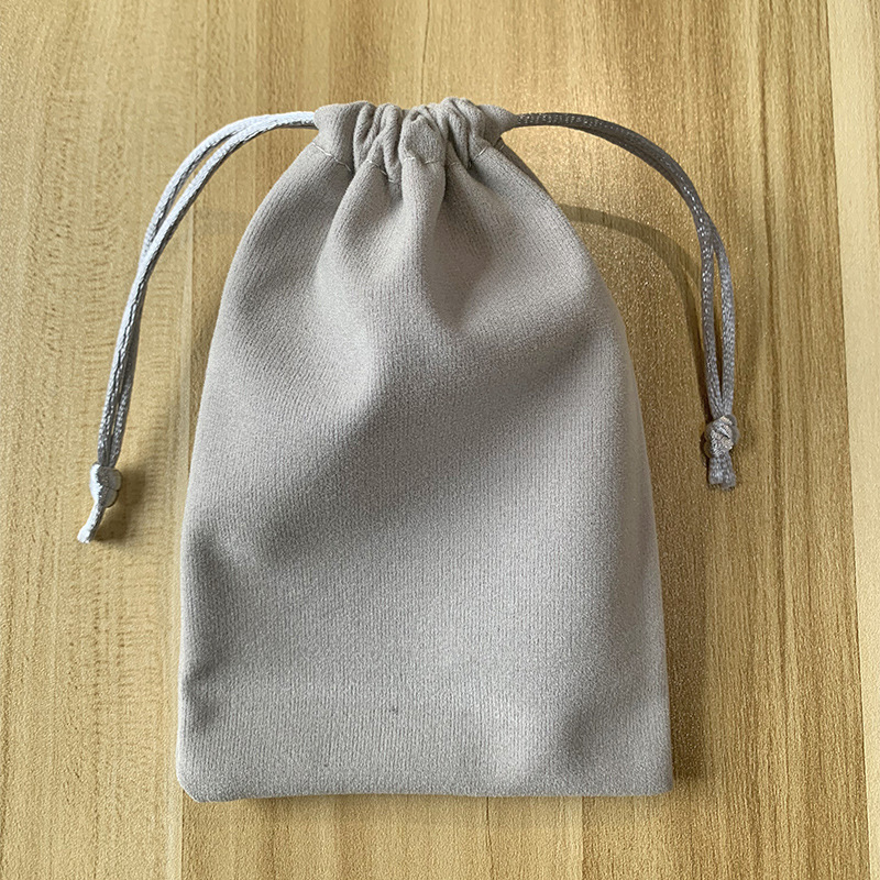 Picture of Boutique bunched flannel bag first jewelry seal text play packaging bag printed electronic products hand string gift storage bag
